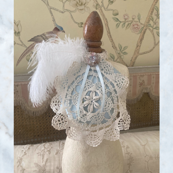 mannequin with lace and feathers